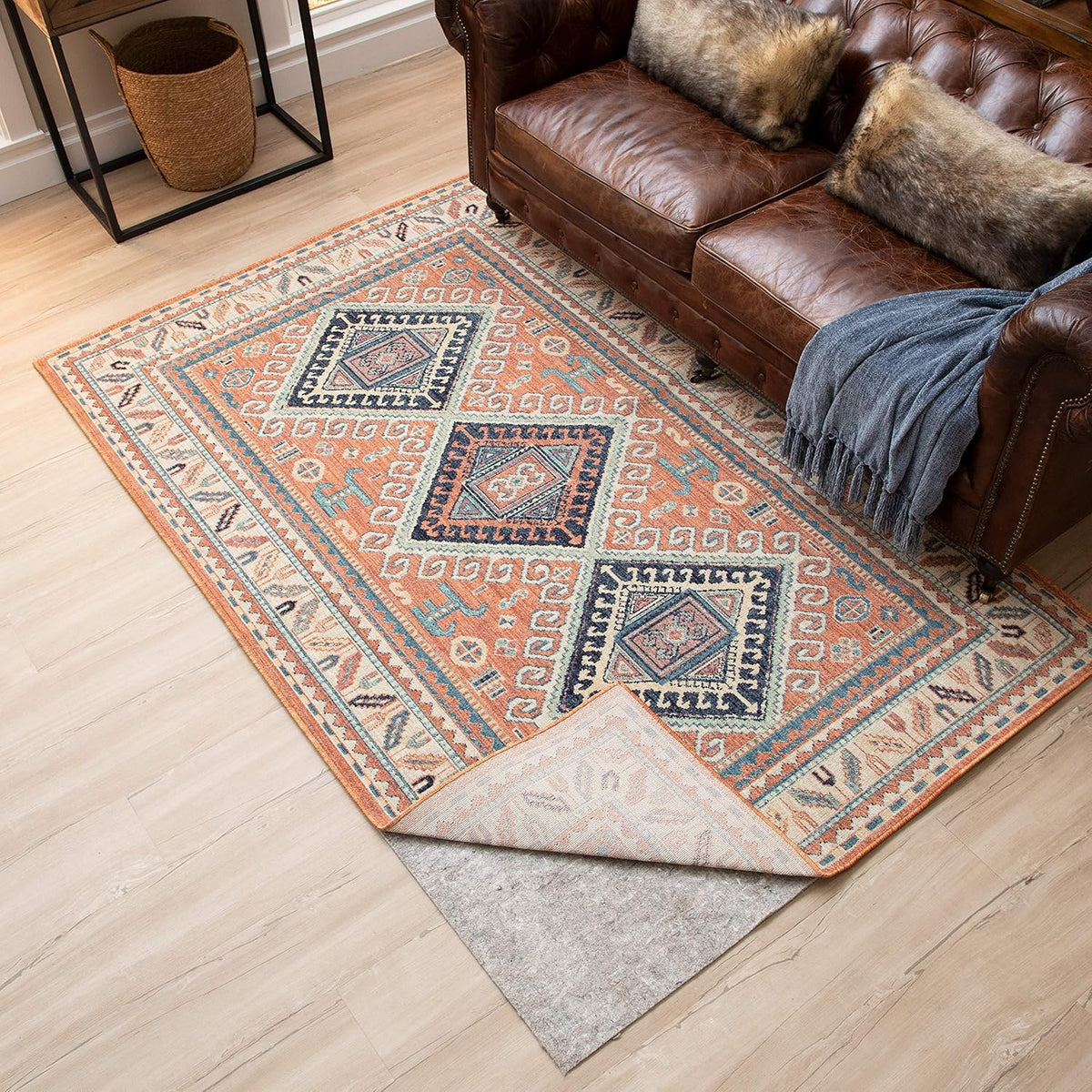 Rug pad under an area rug in a living room